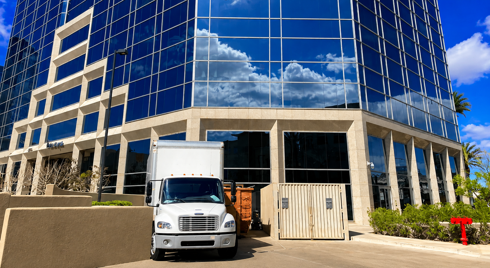 Gilbert Moving crew loading labeled office equipment during a Mesa commercial move